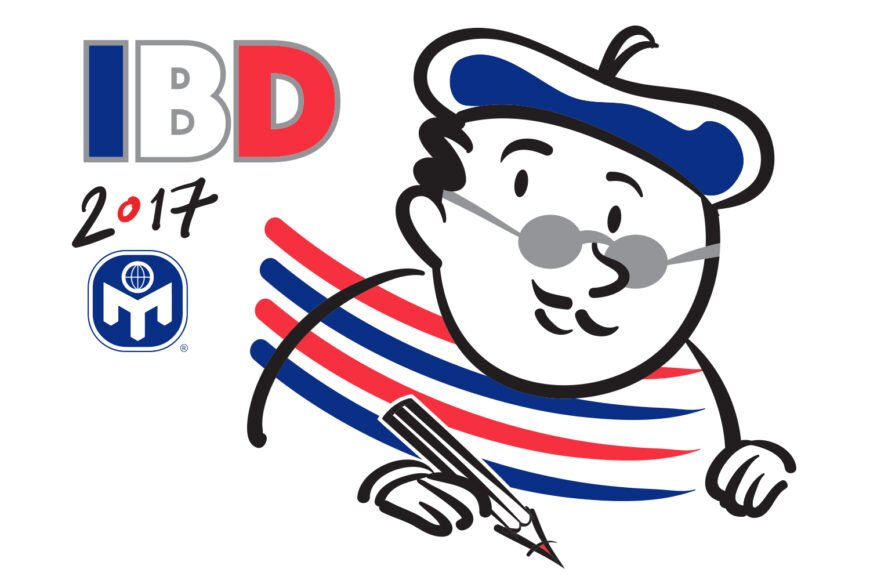 Cartoon character in beret with pen, "IBD 2017" text, red and blue stripes, "M" logo.