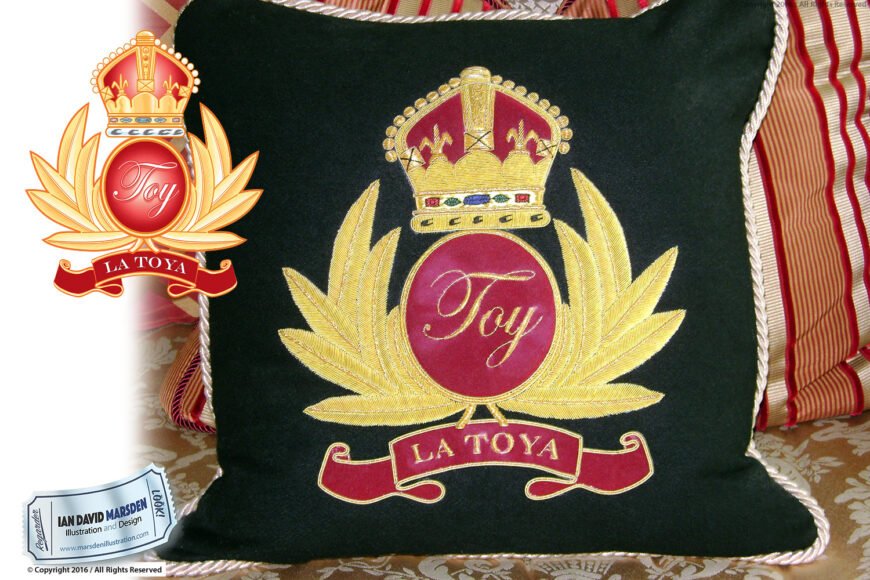 Cushion with embroidered crown, red circle labeled "Toy," gold leaves, and red "La Toya" banner.