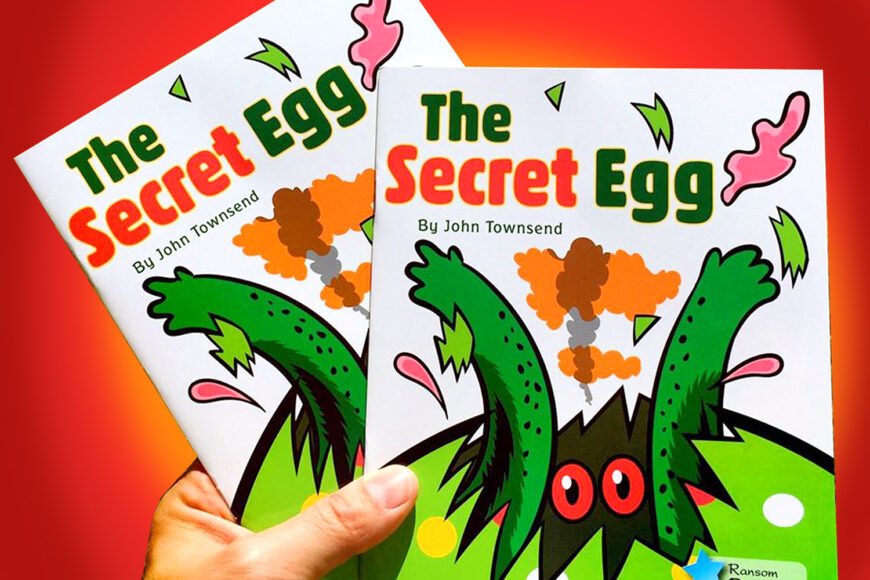 Two copies of "The Secret Egg" book by John Townsend with colorful creature illustration.