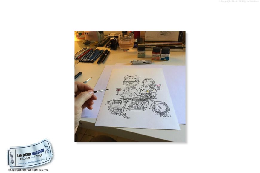 Artist coloring a caricature of two people with wine glasses beside a motorcycle at a desk.