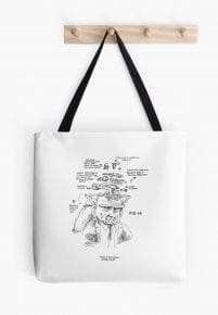 White tote bag with black straps featuring a satirical diagram illustration of a person's head.