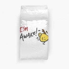 White duvet with yellow coffee cup illustration, antlers, and "I'm Awake!" text.