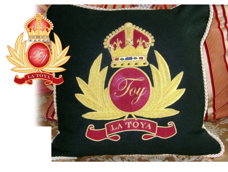 La Toya Jackson embroidered TOY crest pillow design