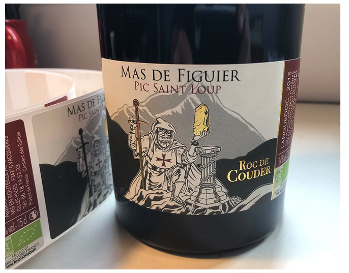 Wine bottle labeled "Mas de Figuier Pic Saint Loup" 2015, 13.5% alcohol, Languedoc region.