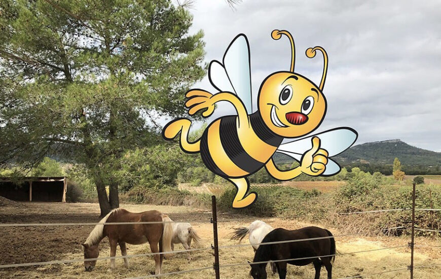 Cartoon bee above horses grazing in a rural fenced area with trees and mountains.