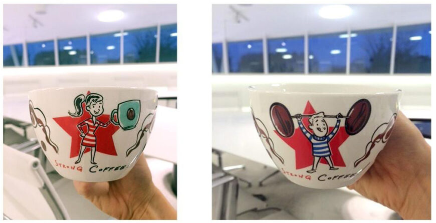 White mug with cartoon characters, girl with mug, boy with barbell, red star backdrop, "Strong Coffee".