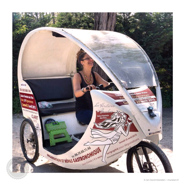 Branded vélo-taxi with wine event wrap, used at Salon du Vin Pic Saint Loup.