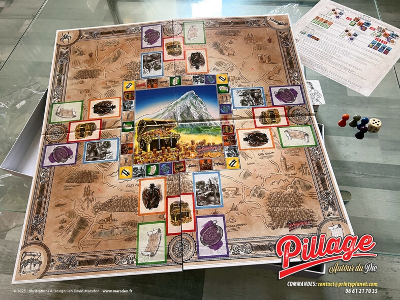 Plateau imprimé du jeu de société Pillage autour du Pic avec cartes, pions, dé, règles et éléments illustrés autour du Pic Saint-Loup.