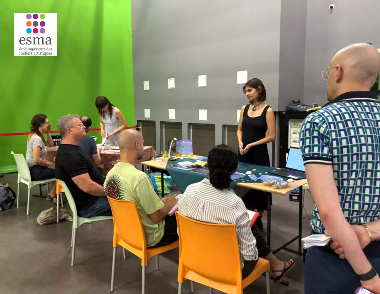 Ian David Marsden seated on the left in black during an ESMA Illustration Concept Art 2026 student project presentation in Montpellier.