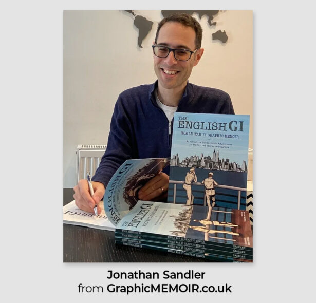 Jonathan Sandler smiling while signing copies of his graphic memoir The English GI, with the book cover displayed in front of him.
